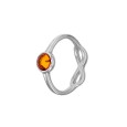 Piccolo anello in pietra d'ambra con segno dell'infinito traforato in argento rodiato