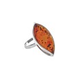 Silver ring adorned with a large oval amber stone