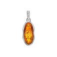 Oval pendant in amber in a rhodium silver frame
