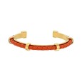 Open gold steel bracelet with a synthetic coral cord
